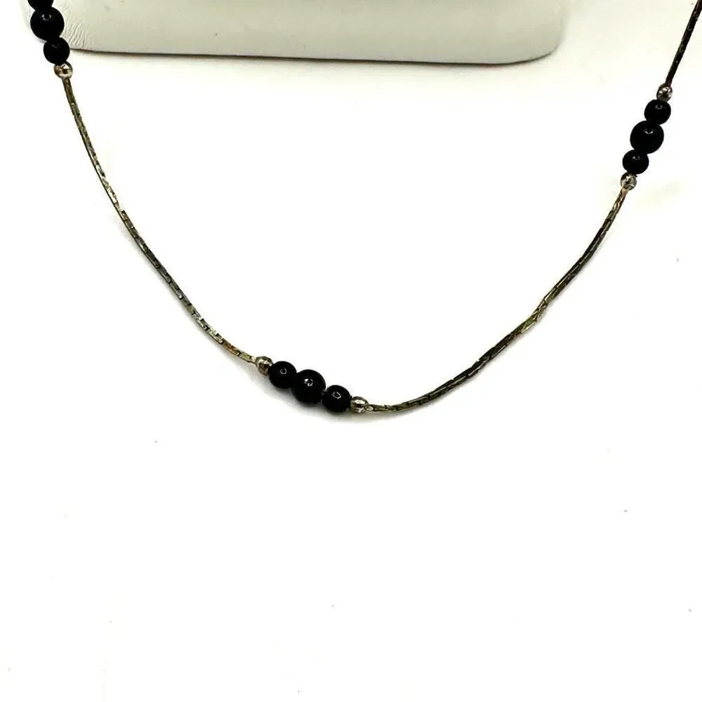 Black and silver tone long beaded necklace